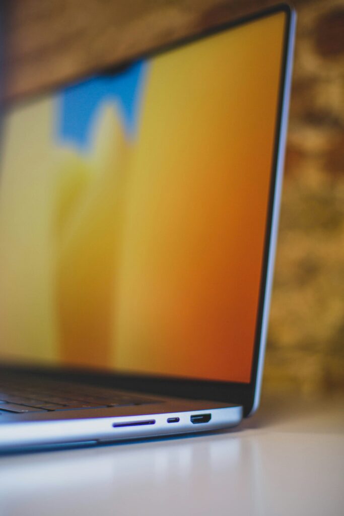 Slim and modern side profile of a laptop with vibrant display