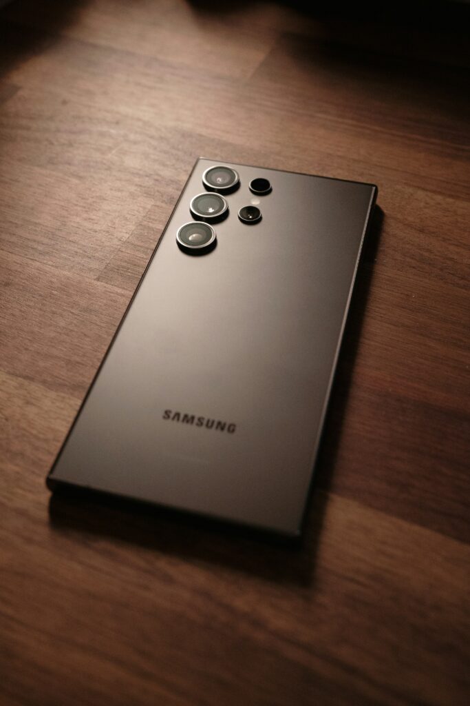 Rear camera design of Samsung Galaxy S24 Ultra placed on wooden surface