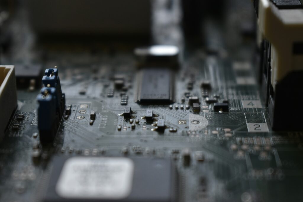 Macro shot of a computer motherboard representing Apple silicon and internal hardware