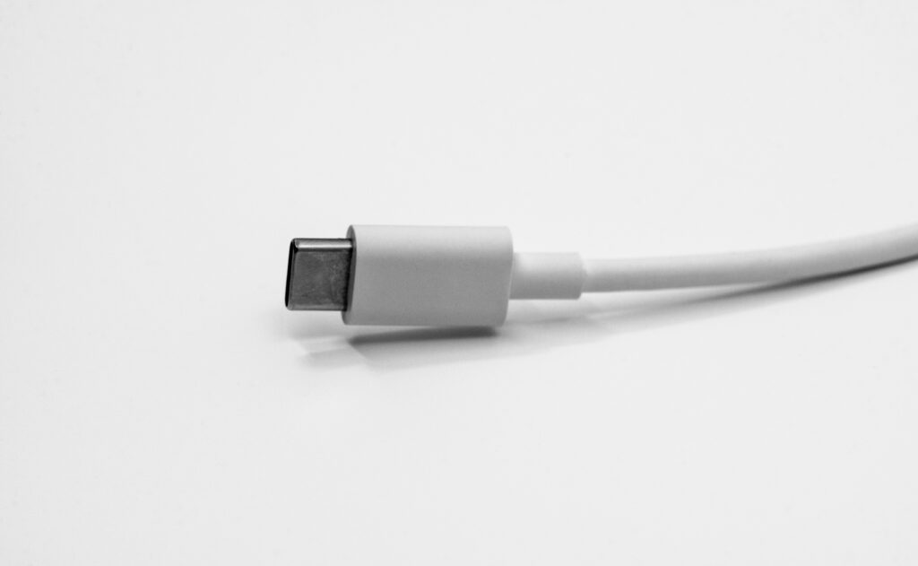 Close-up of USB-C charging cable – common connector for modern wireless headphones.
