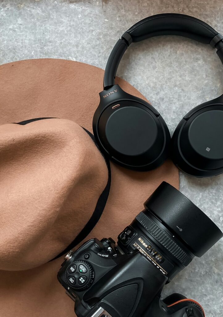 Sony WH-1000XM6 headphones on a soft beige surface – premium noise-canceling design highlighted.