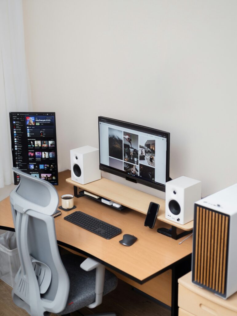 Modern minimal workstation with dual screens and neutral tones