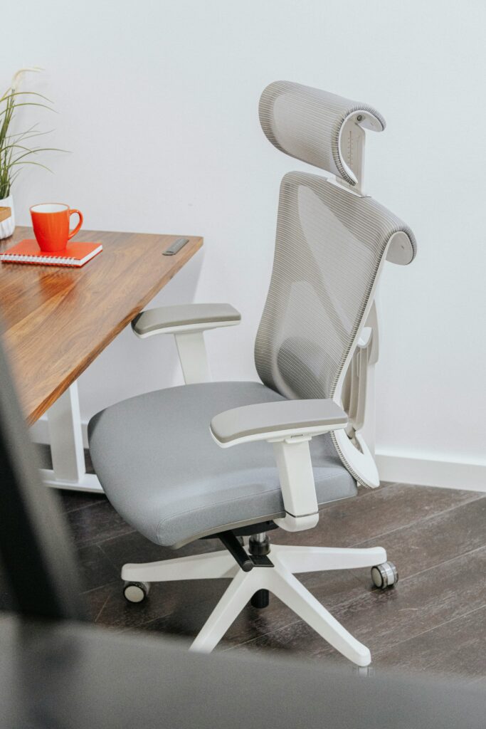 Ergonomic chair next to a clean wooden desk for a comfortable work-from-home setup