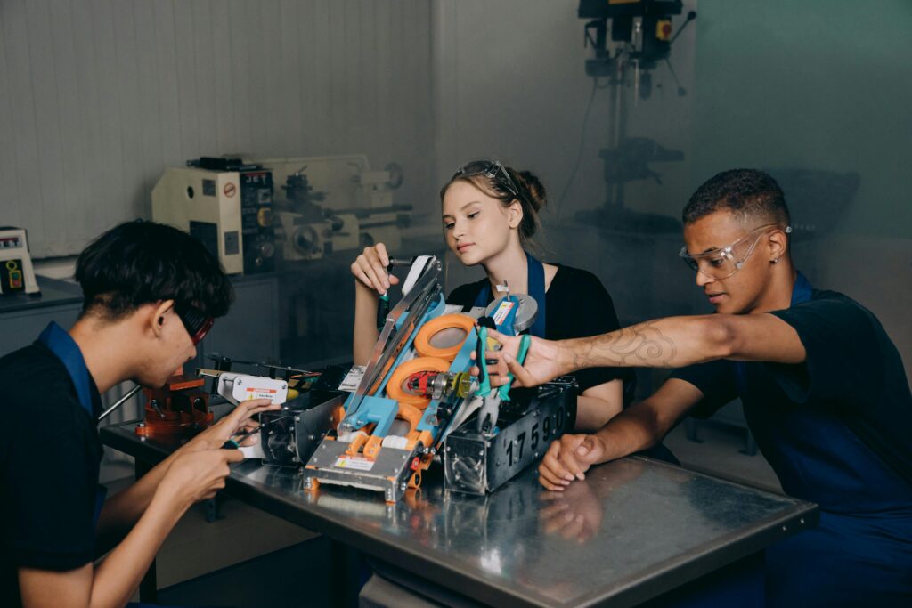 Young engineers building a robot prototype, shaping the future beyond the 2025 AI race