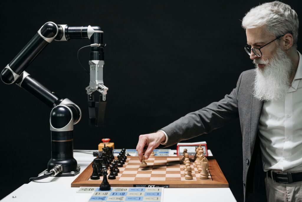 AI-powered robot playing chess with a human — symbol of human-AI collaboration