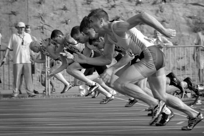 Athletes sprinting from the starting line symbolizing the competitive AI race 2025